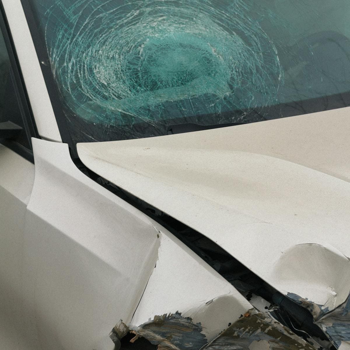 Accident-damaged vehicle in for collision and windshield repair